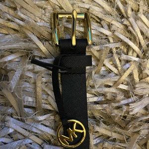 Michael Kors gold tassel emblem belt.